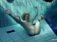 KiloTube presents: Blonde goes for a swim and strips